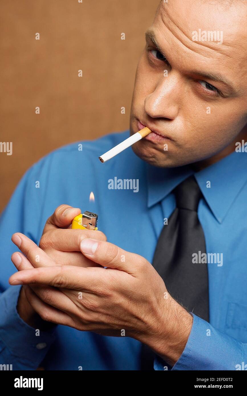 Close up of a mid adult man smoking Stock Photo