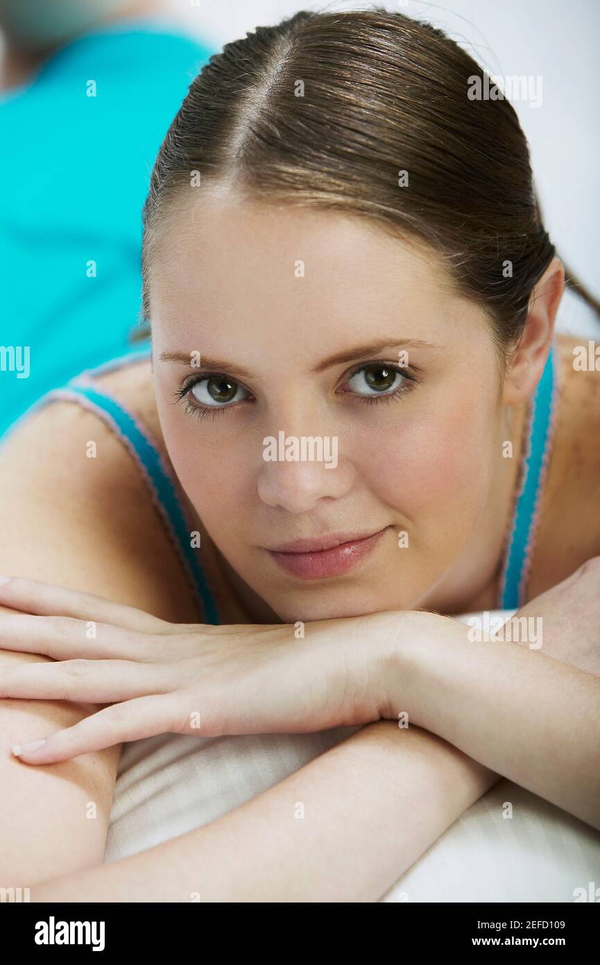 Portrait of a young woman lying down Stock Photo Alamy