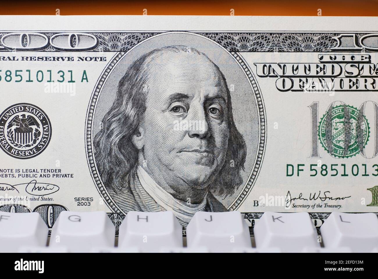 Dollar bill on keyboard hi-res stock photography and images - Alamy