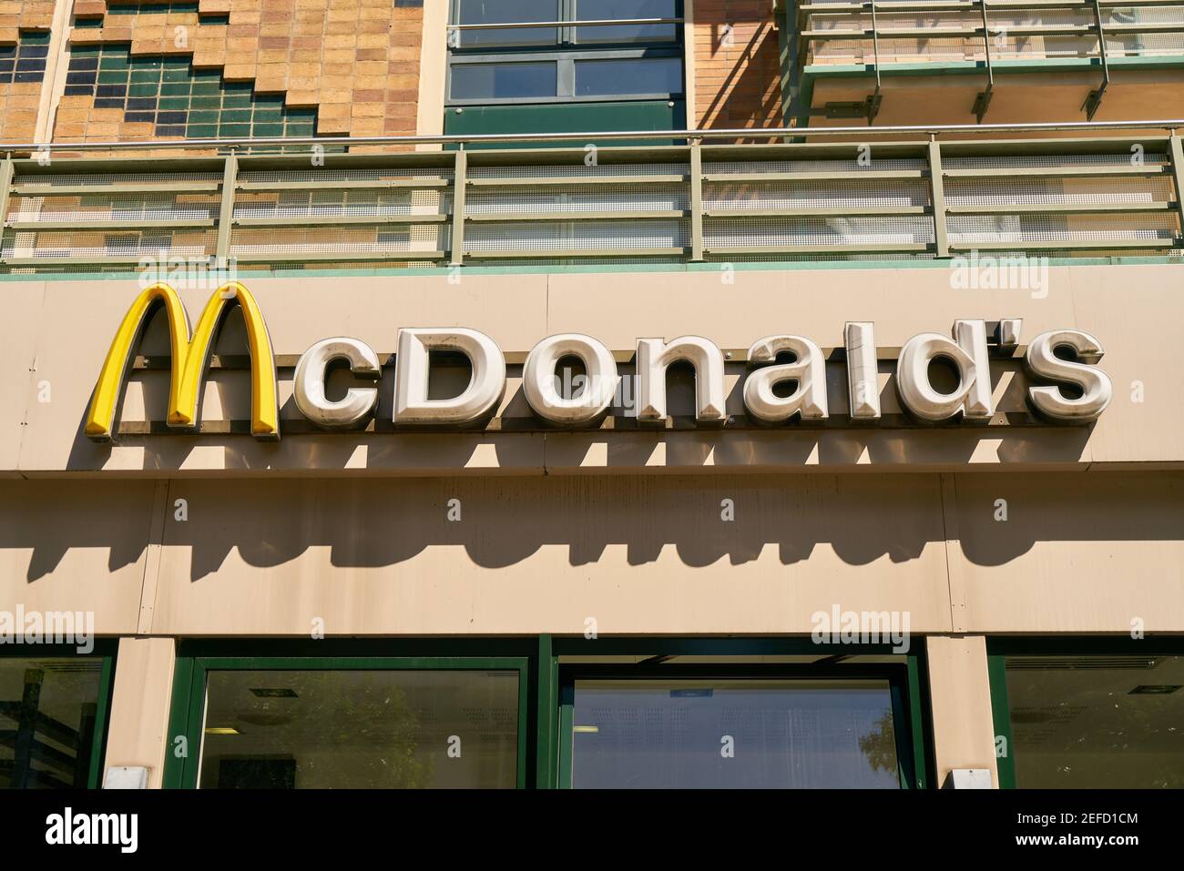 ROSTOCK, Germany, July 2020: logo and name of Fast Food chain McDonald's over restaurant Stock Photo