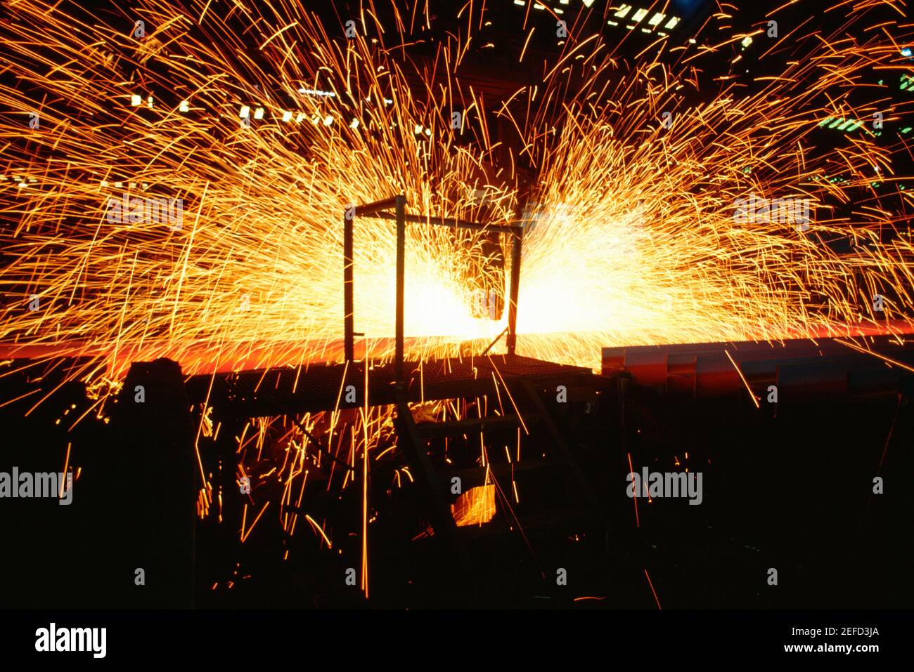 Hot saw cutting steel beams, Illinois, USA Stock Photo Alamy