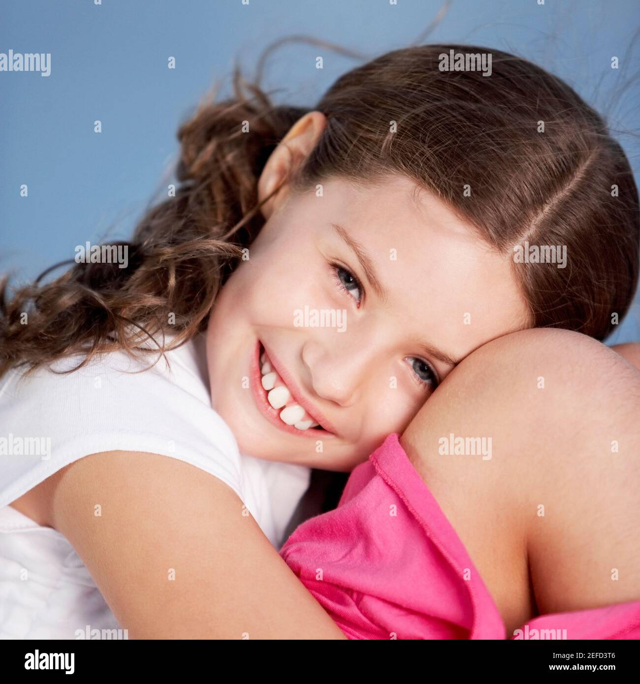 Close-up of a girl hugging her knees Stock Photo - Alamy