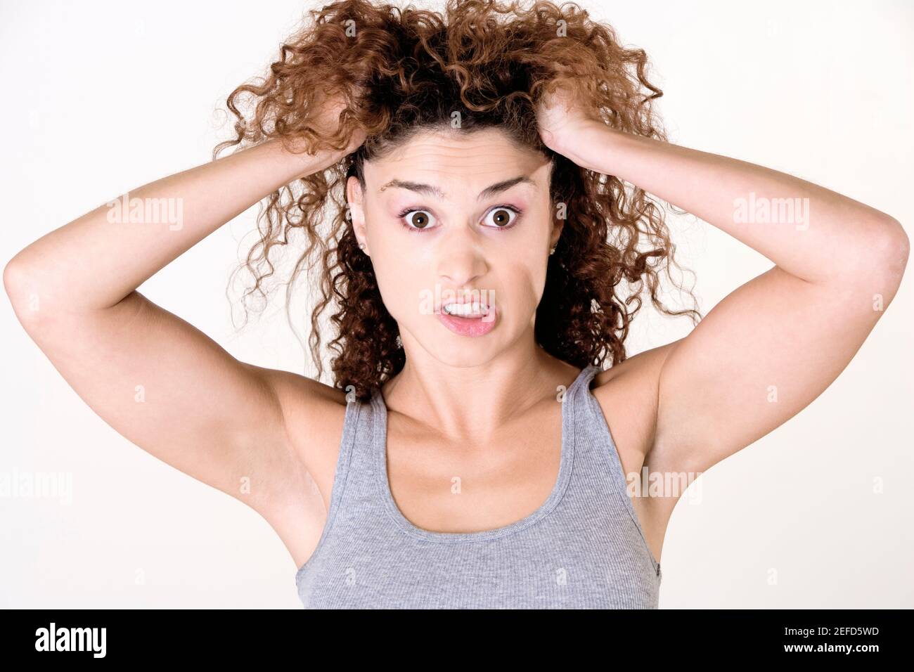 Angry young woman raising hand hi-res stock photography and images - Alamy