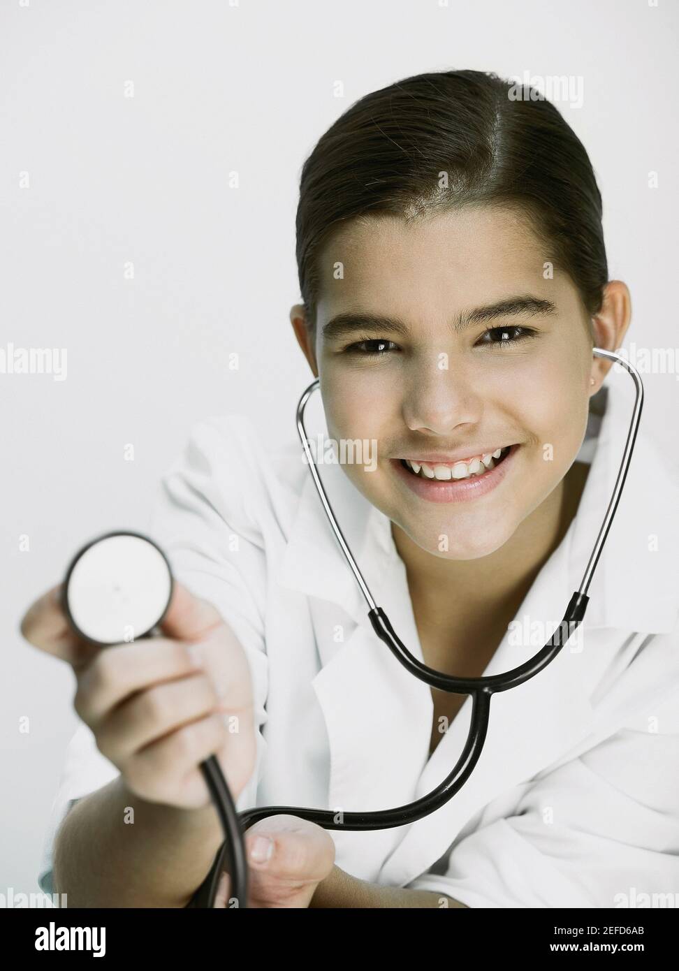 Portrait of a girl showing a stethoscope Stock Photo Alamy