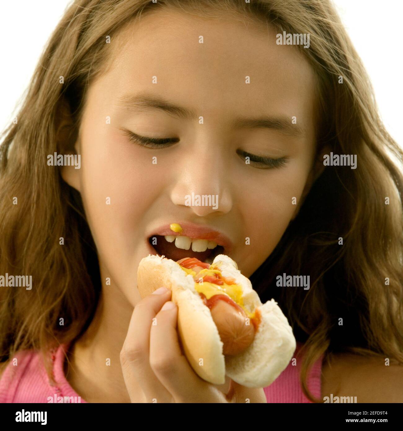 Kid eating hot dog hi-res stock photography and images - Alamy