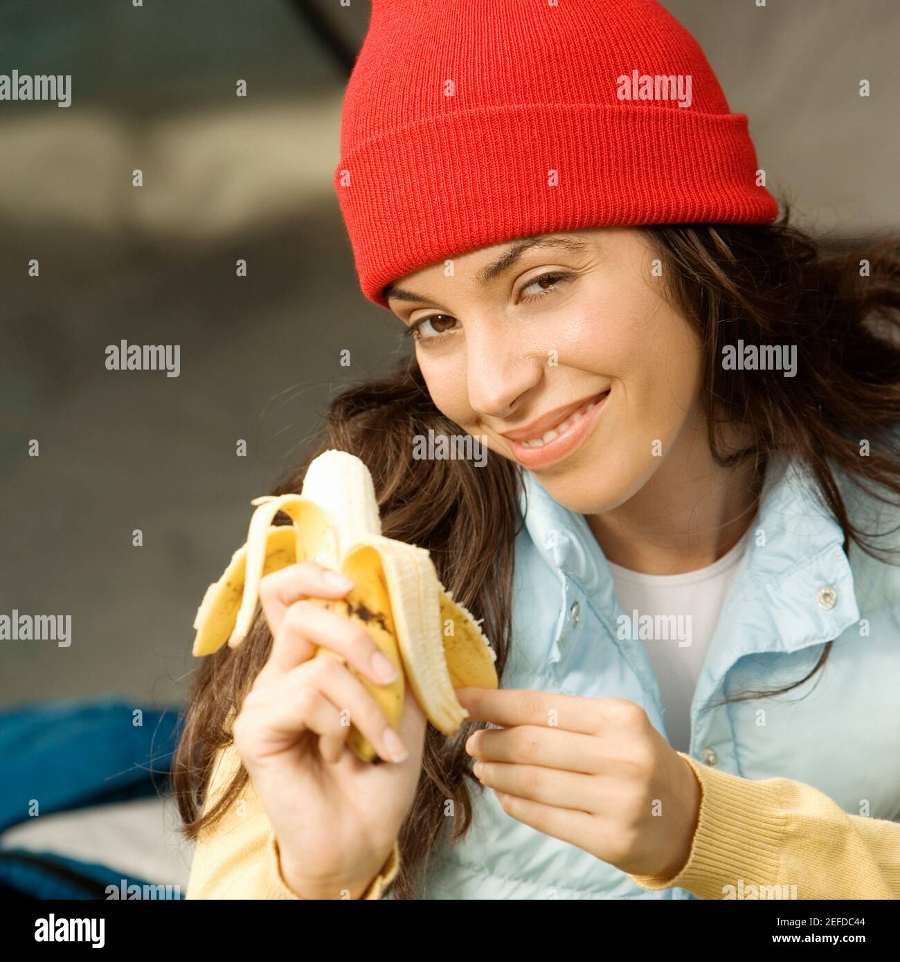 portrait-of-a-young-woman-peeling-a-banana-stock-photo-alamy