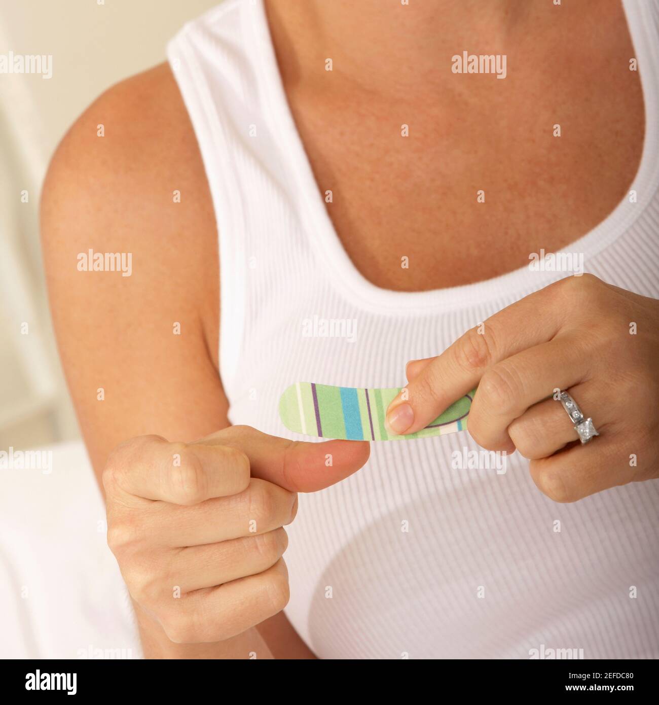 Close-up of a mid adult woman using a nail file Stock Photo