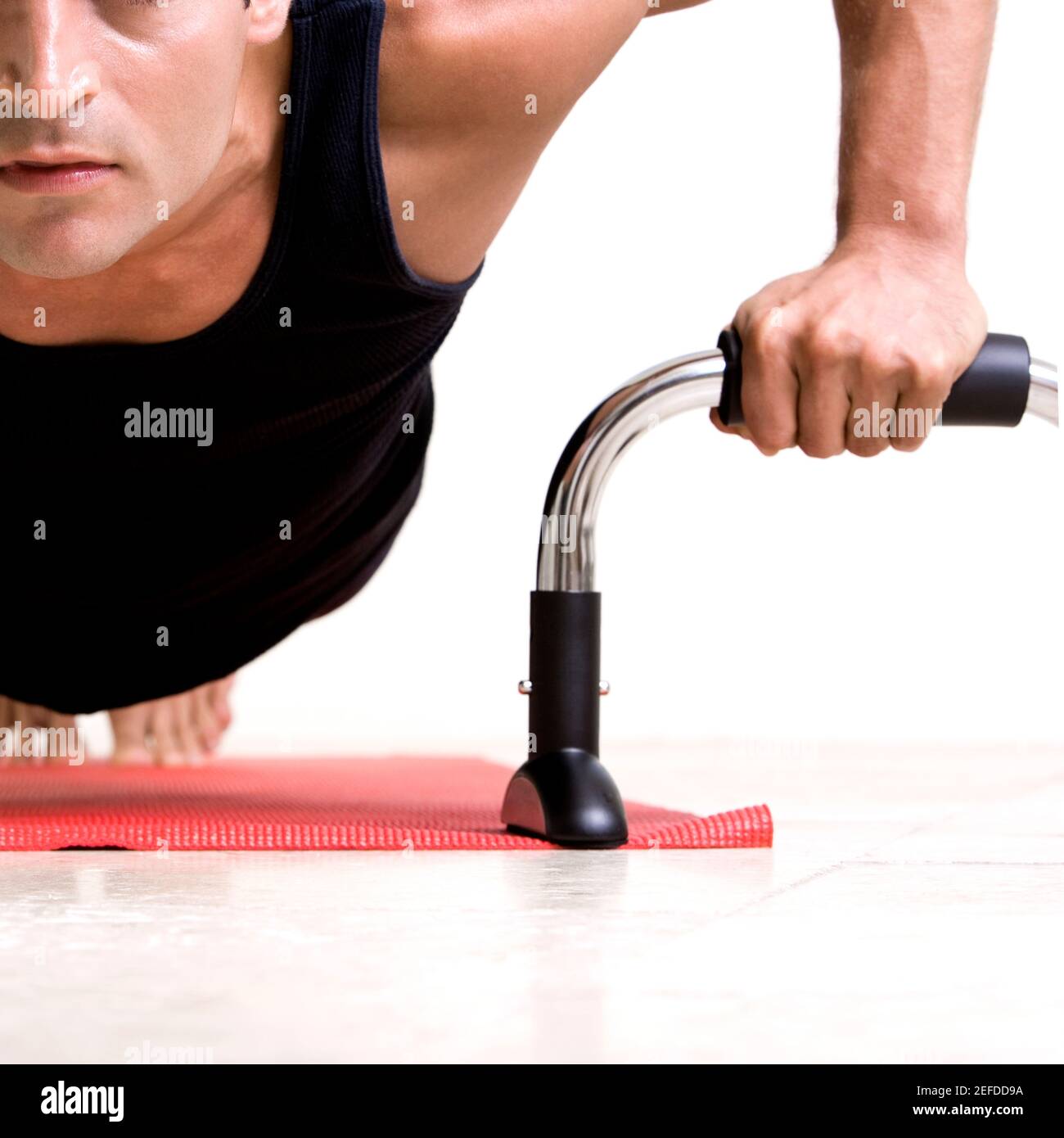 Close-up of a mid adult man doing push-ups Stock Photo