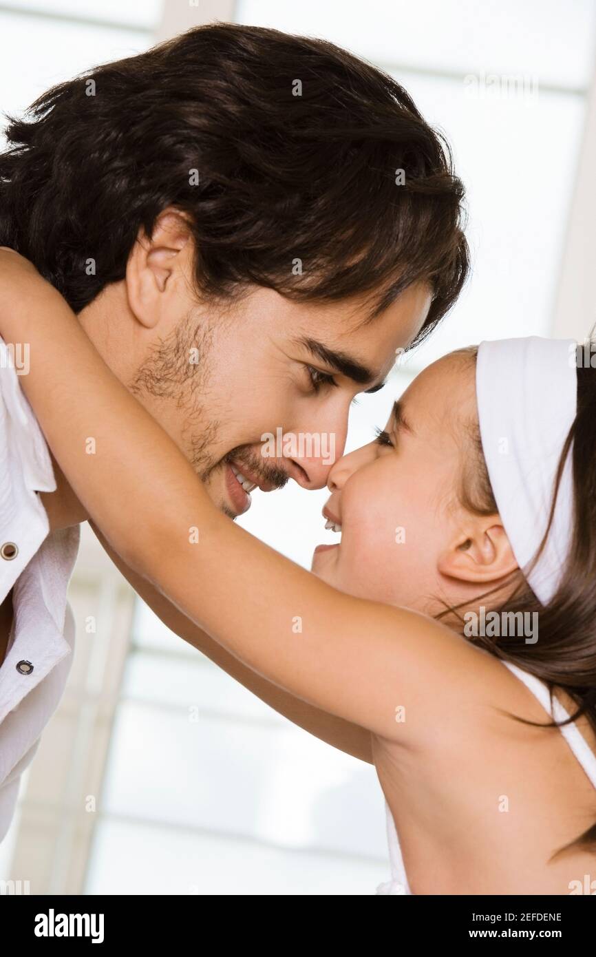 Side profile of a father looking at his daughter Stock Photo