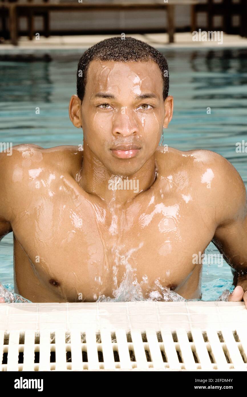 Portrait of a young man in a swimming pool Stock Photo - Alamy