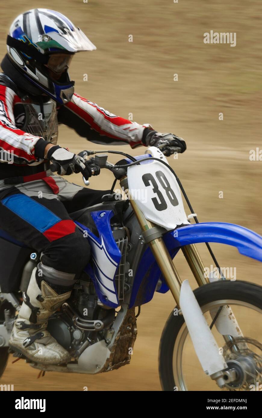 Side profile of a motocross rider riding a motorcycle Stock Photo Alamy