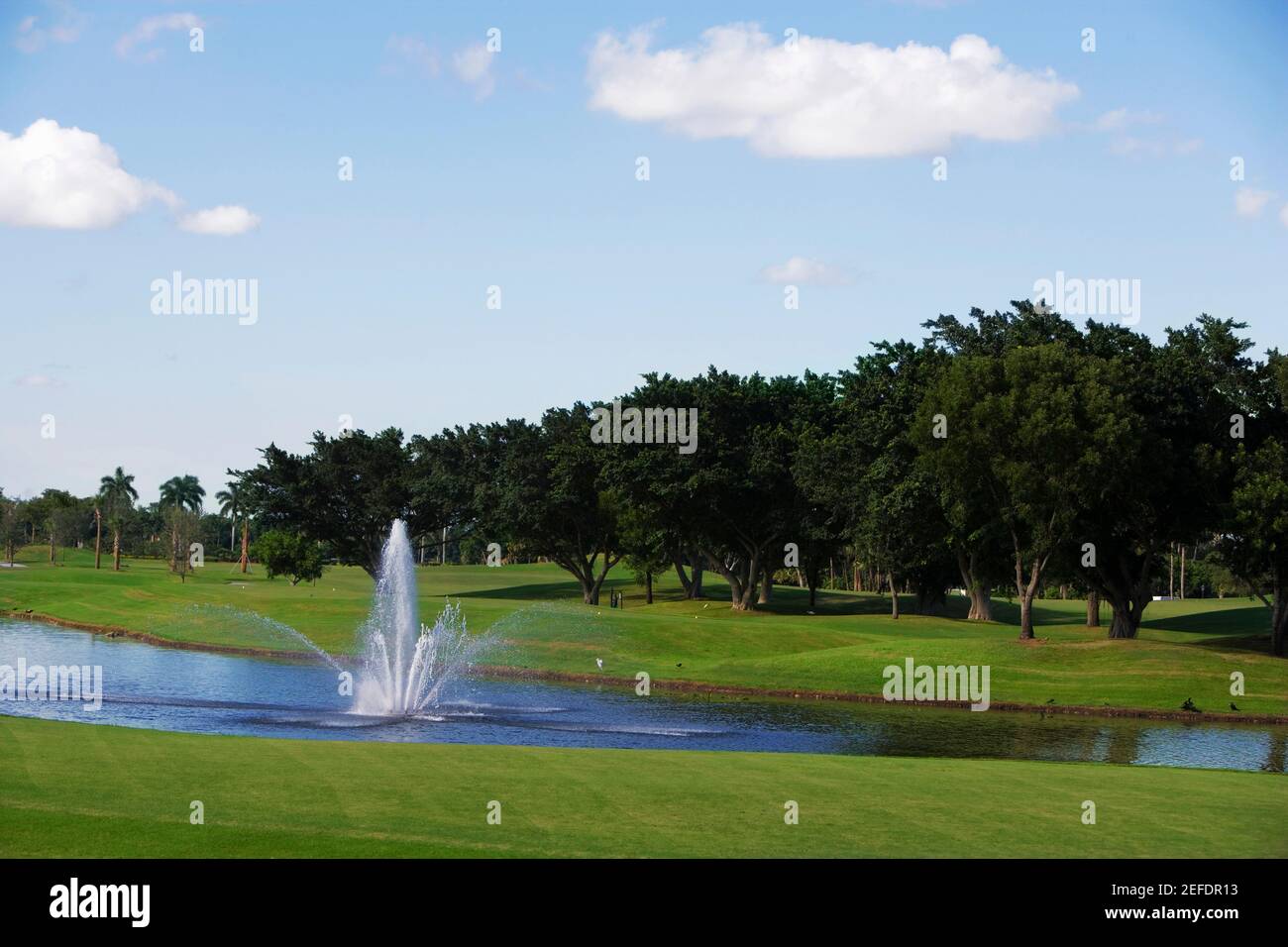 Fountain in a golf course Stock Photo Alamy