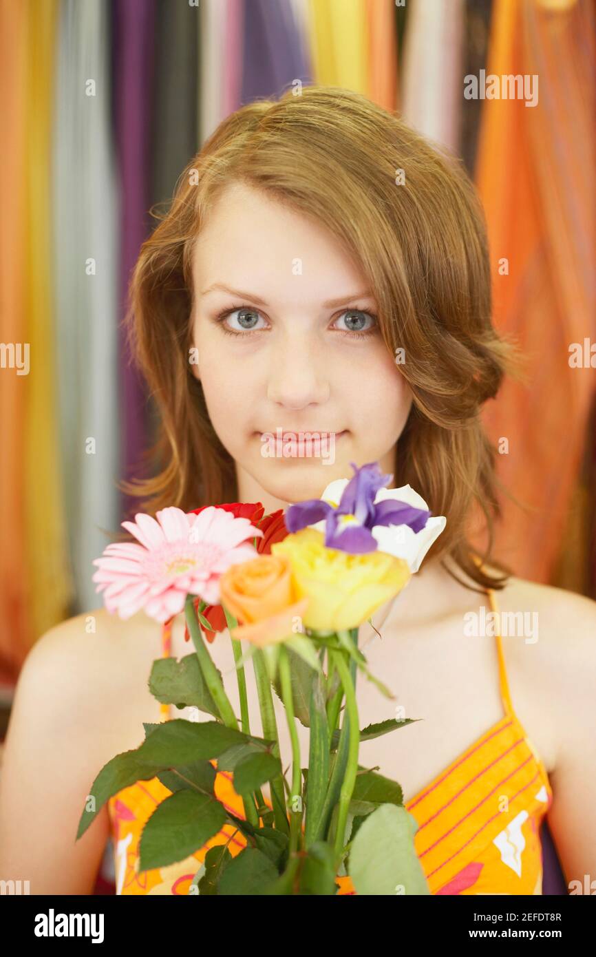Portrait of a teenage girl holding a bouquet of flowers Stock Photo Alamy