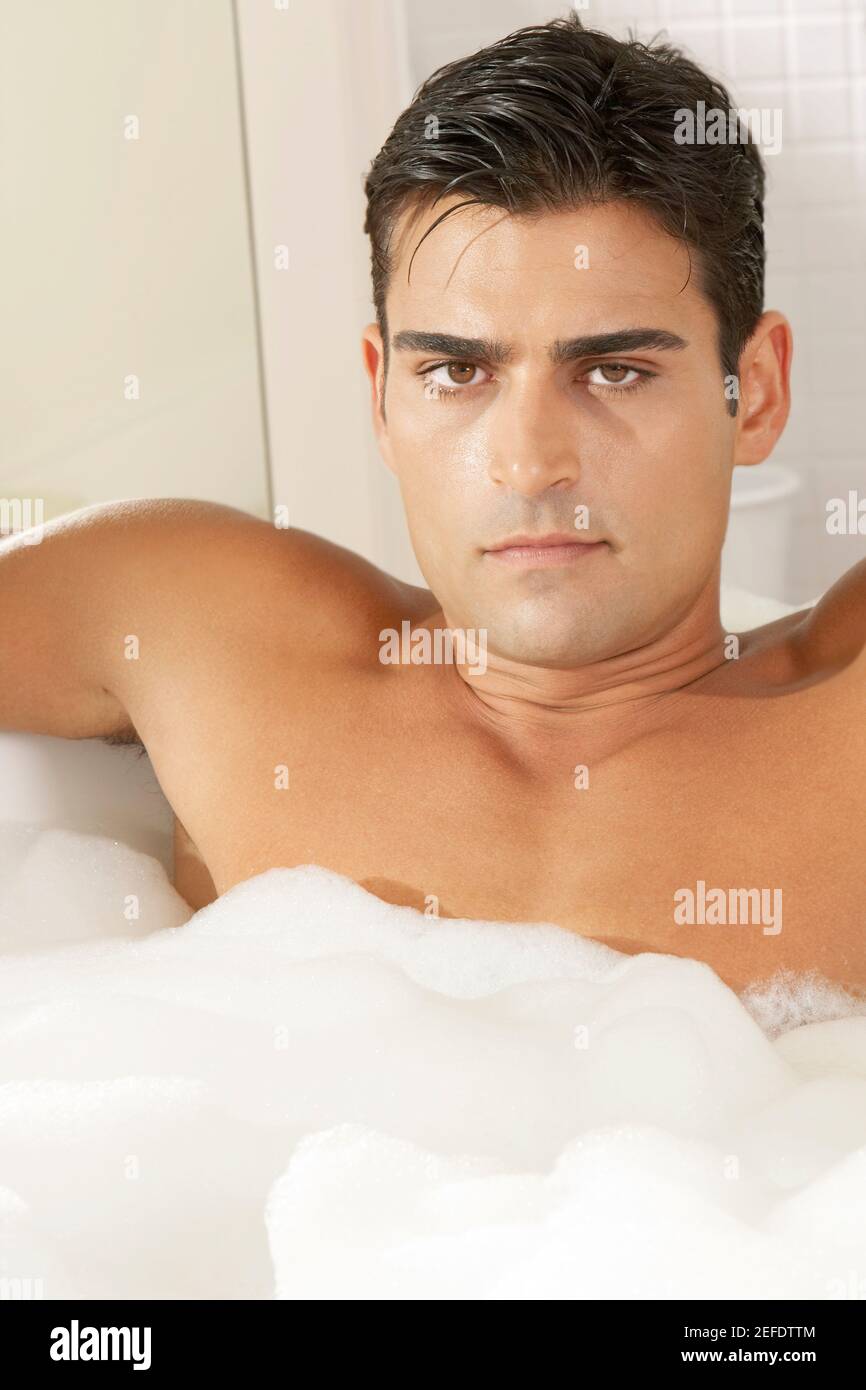 Portrait of a young man in a bubble bath Stock Photo Alamy