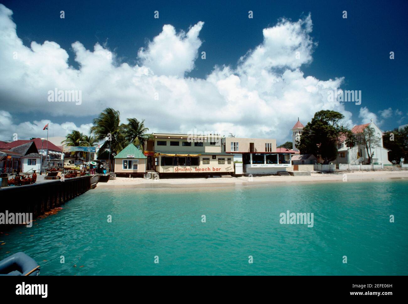 View of a commercial hub along a beach, St. Martin Stock Photo