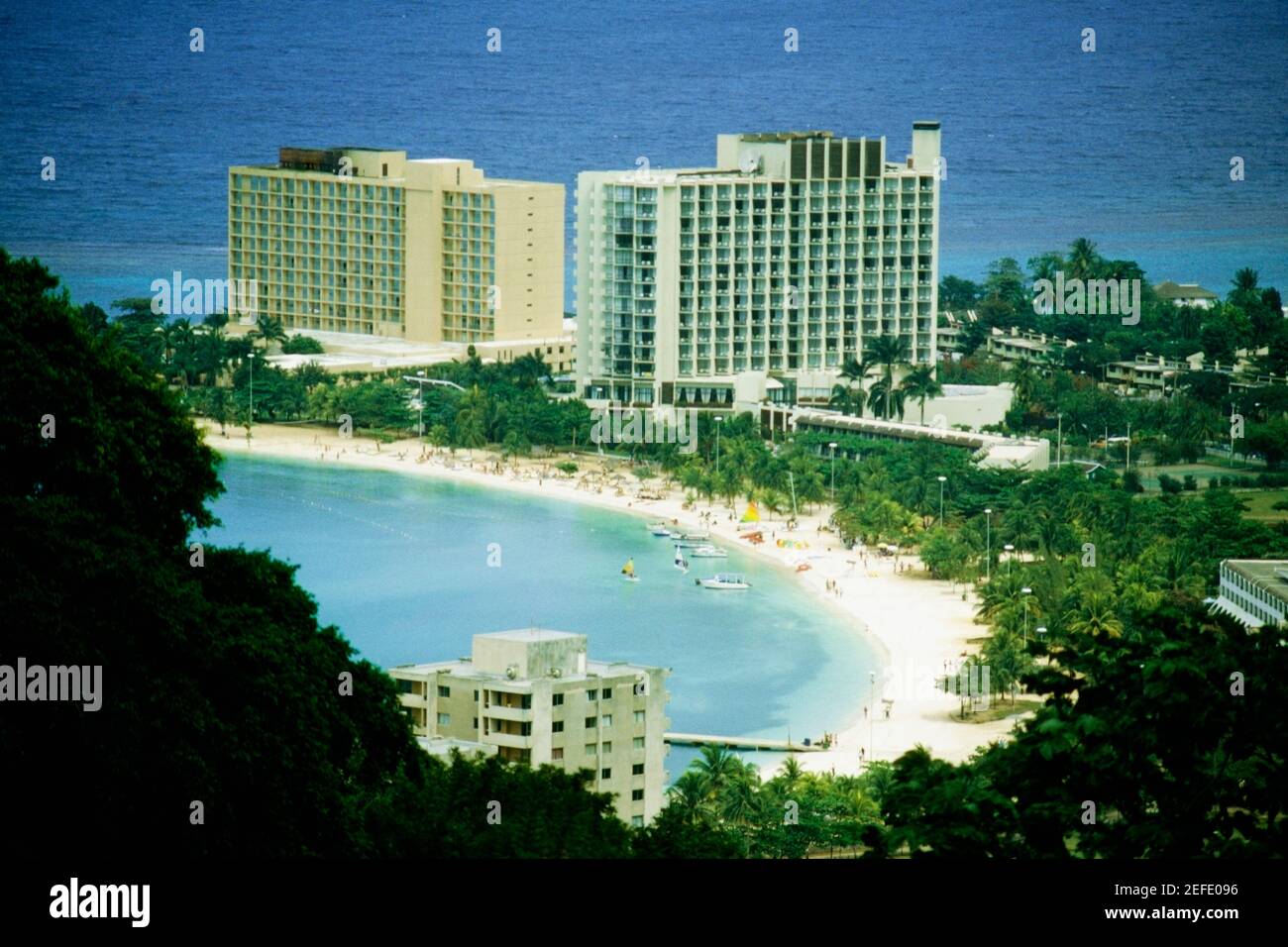 The Hilton Hotel on the island of Jamaica is located on a beautiful white sand beach Stock Photo