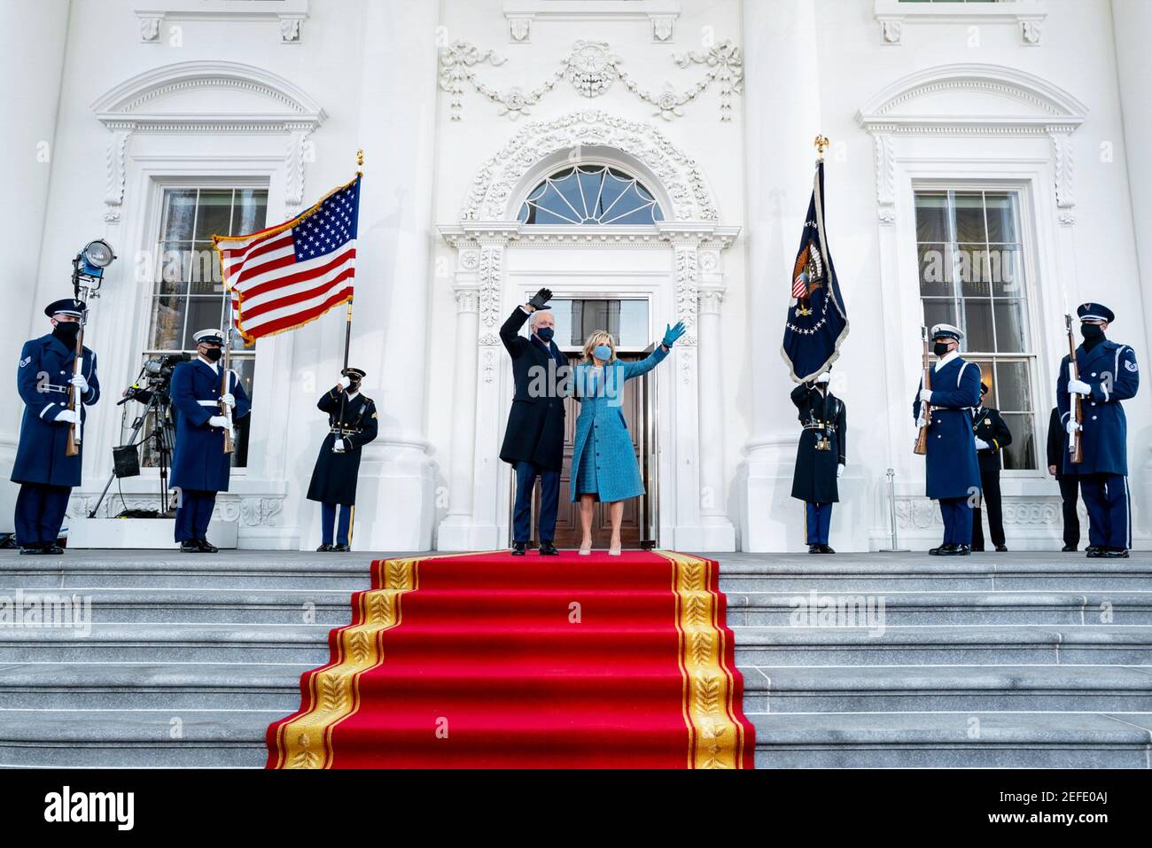President Joe Biden and First Lady Dr. Jill Biden wave from the steps of the North Portico of the White House Wednesday, Jan. 20, 2021, upon arriving to the White House for the first time on Inauguration Day. Stock Photo