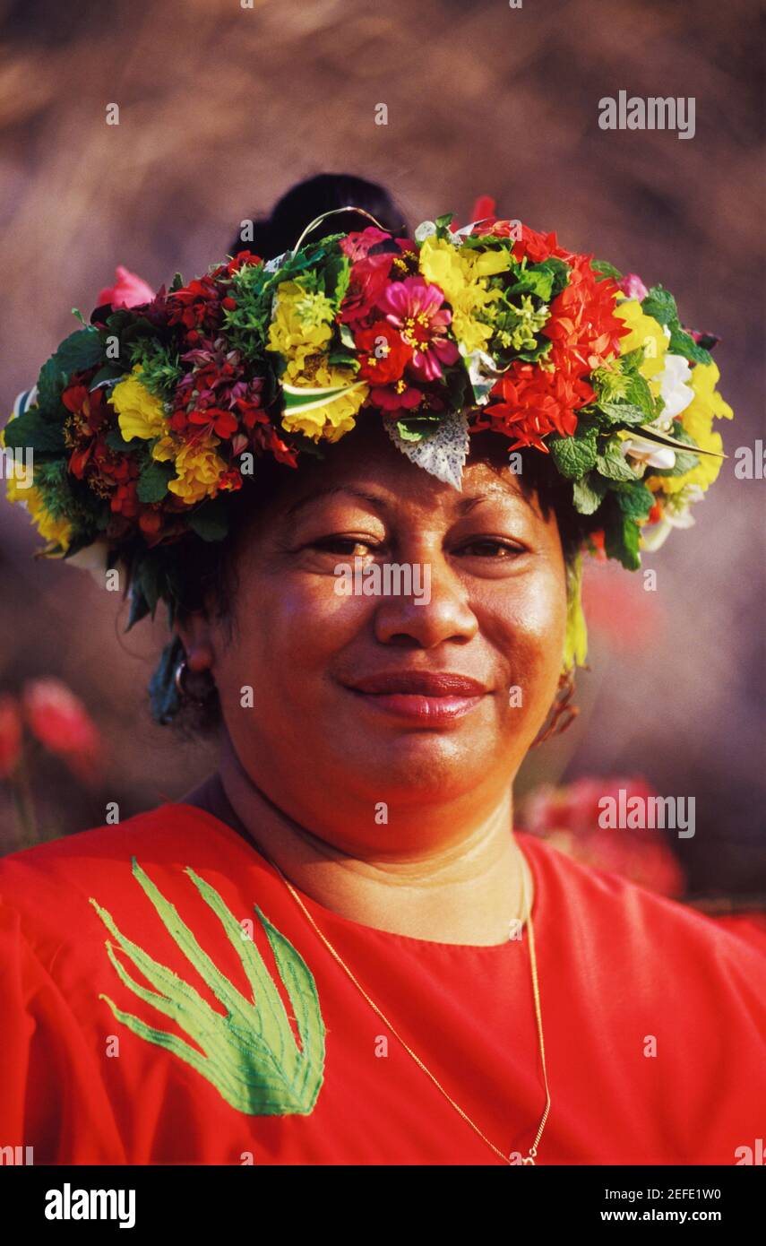 Portrait of a mid adult woman wearing a laurel wreath, Hawaii, USA ...