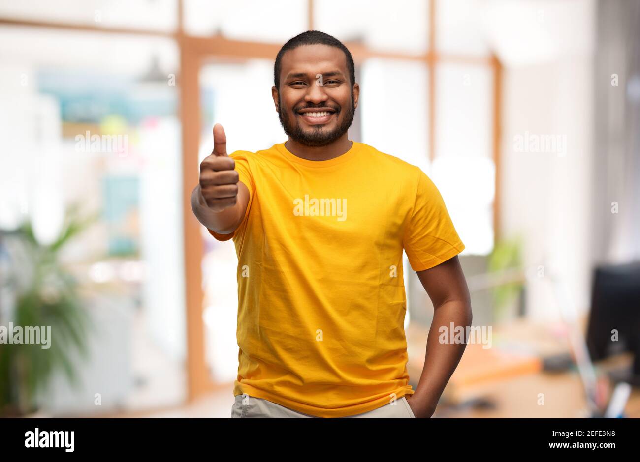 smiling african american man showing thumbs up Stock Photo - Alamy