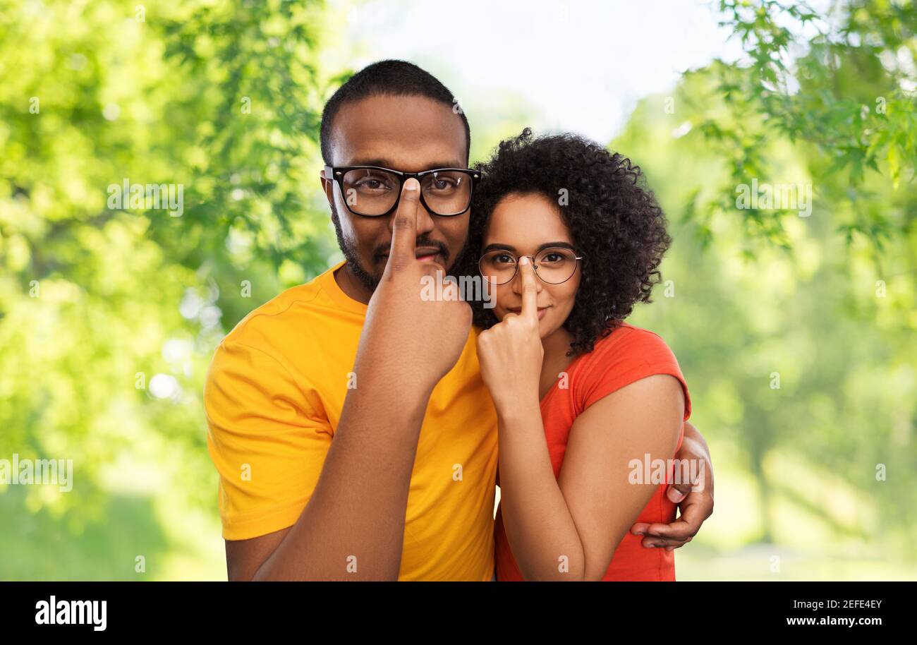 happy african american couple in glasses hugging Stock Photo - Alamy