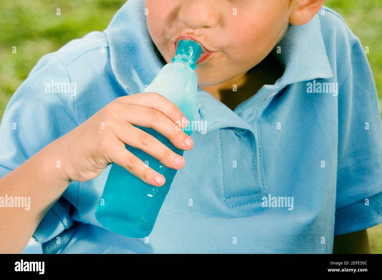 https://c8.alamy.com/comp/2EFE50C/close-up-of-a-boy-drinking-water-from-a-bottle-2EFE50C.jpg