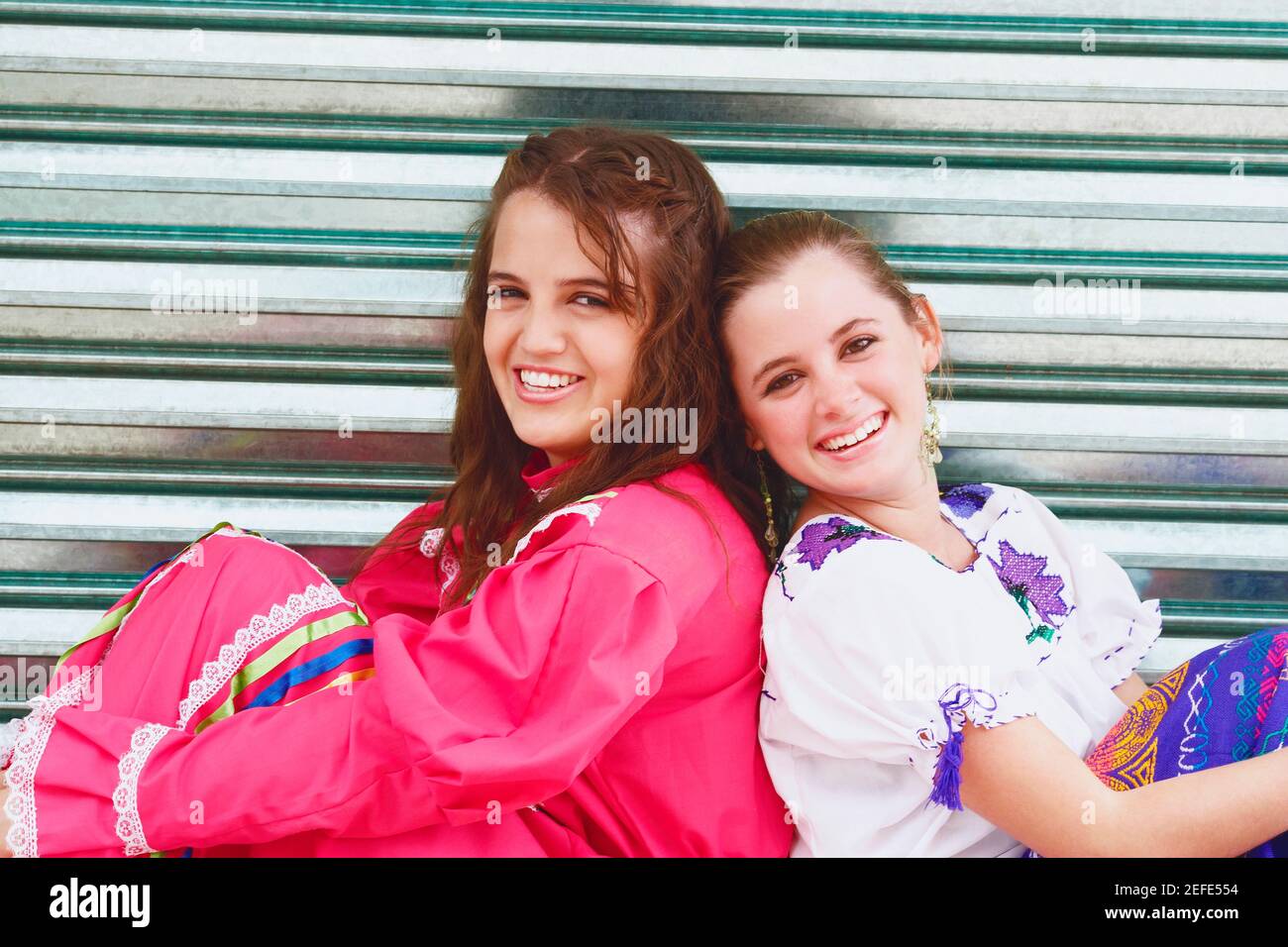 Back view three women hugging hi-res stock photography and images - Alamy