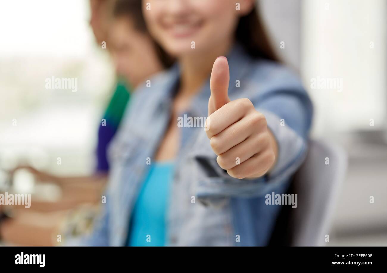 close up of happy student girl showing thumbs up Stock Photo - Alamy