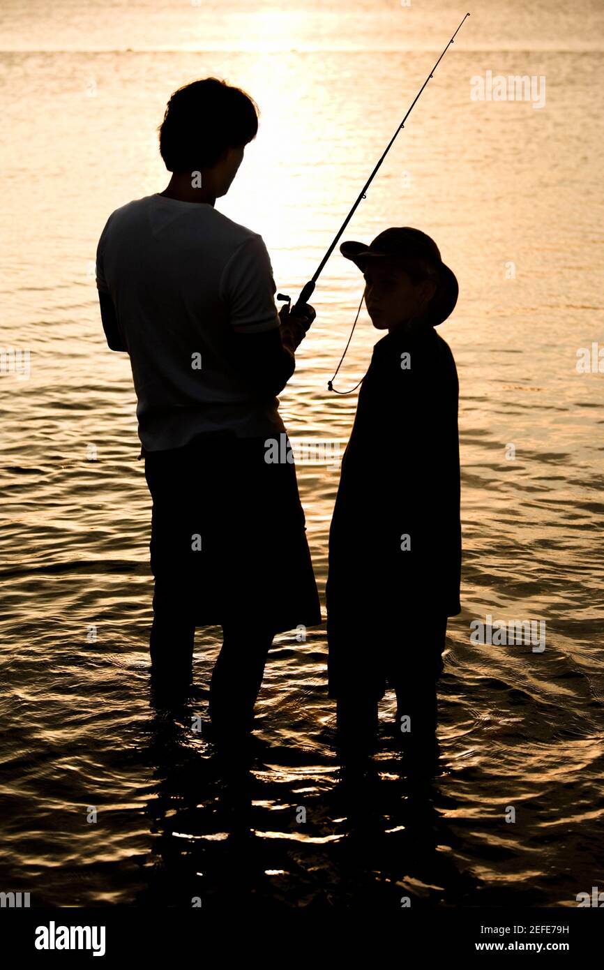 father and son fishing silhouette