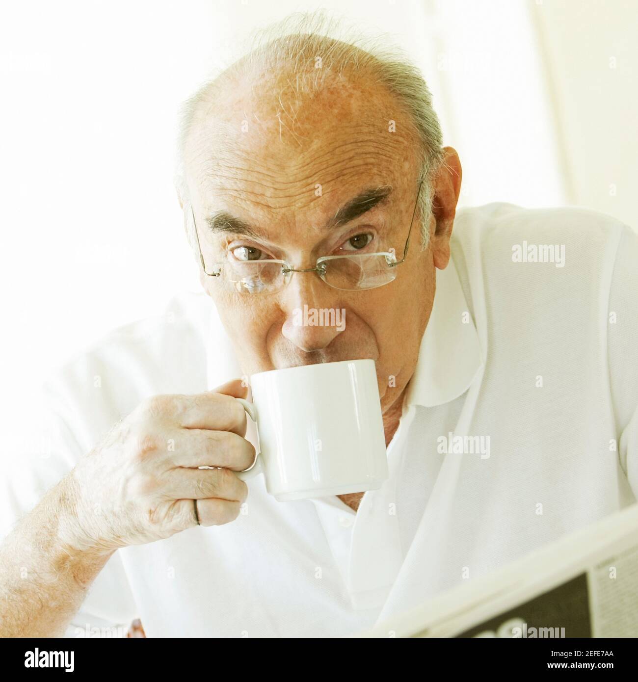 Portrait of a senior man drinking coffee Stock Photo Alamy