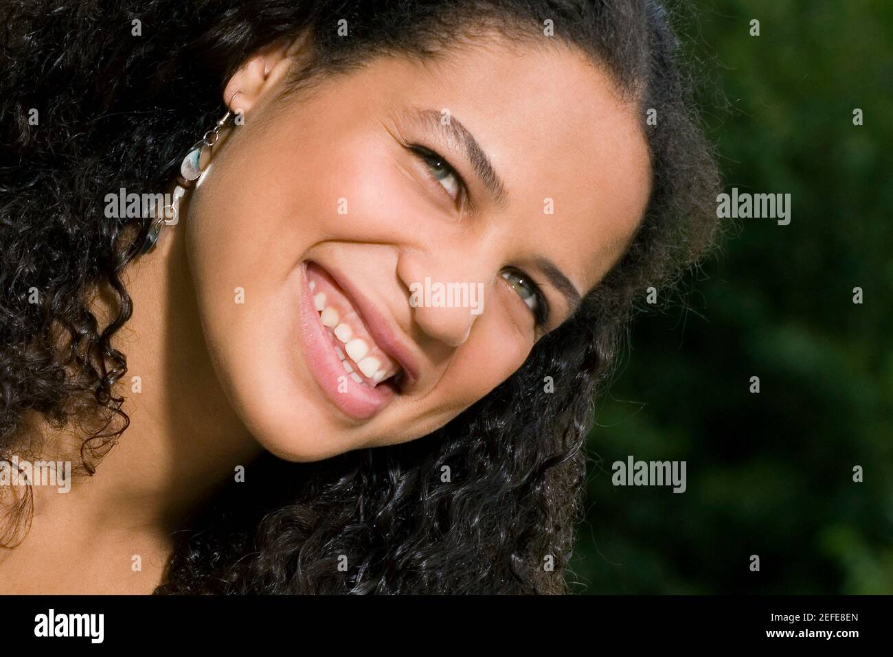 Close up of a teenage girl smiling Stock Photo - Alamy