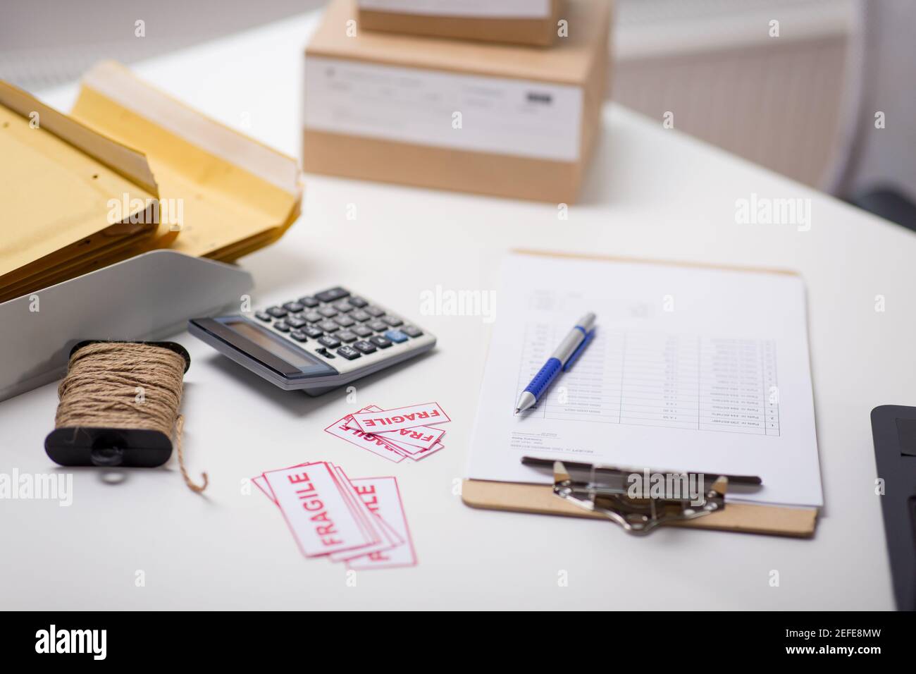 calculator, clipboard and envelopes at post office Stock Photo