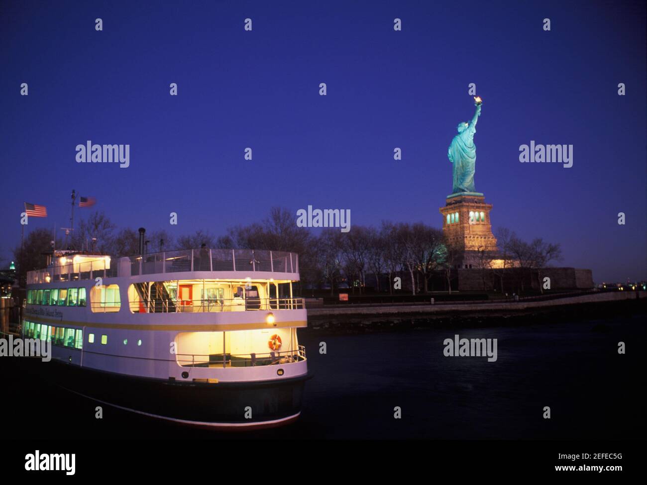 Ferry near a statue, Statue Of Liberty, New York City, New York State