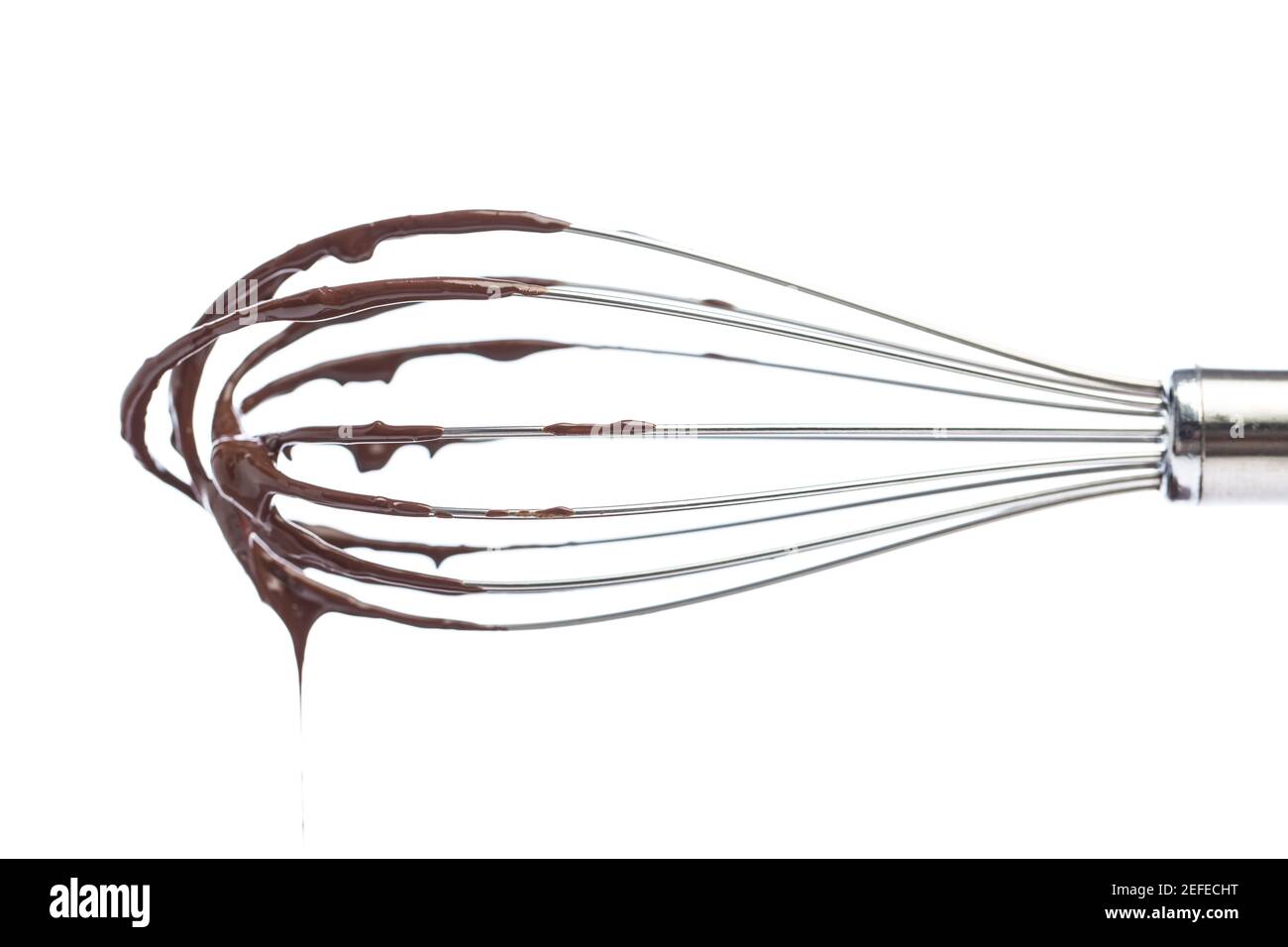 Whisk with soft chocolate isolated on white background Stock Photo