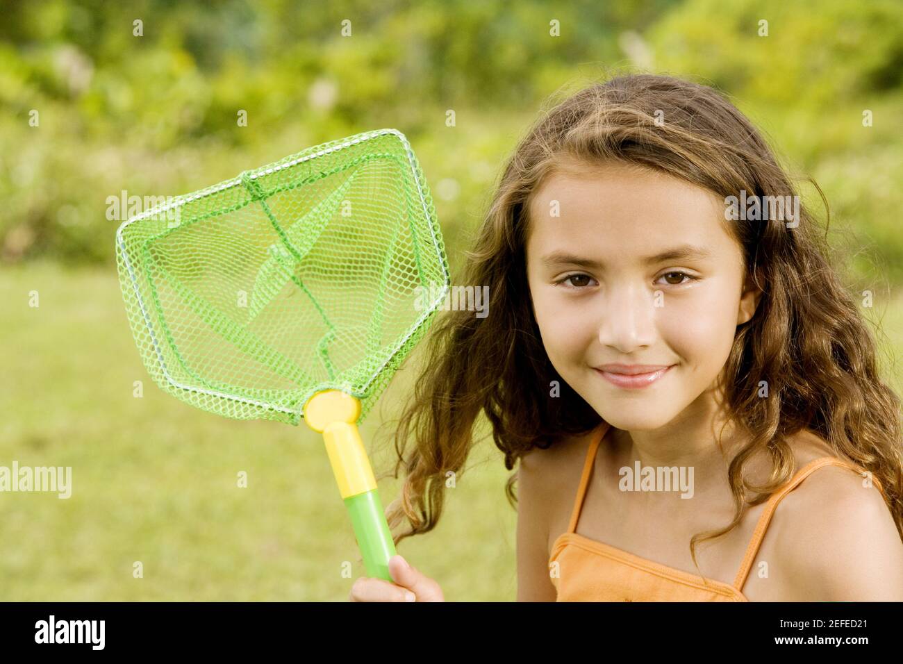 Girl holding a butterfly net hi-res stock photography and images
