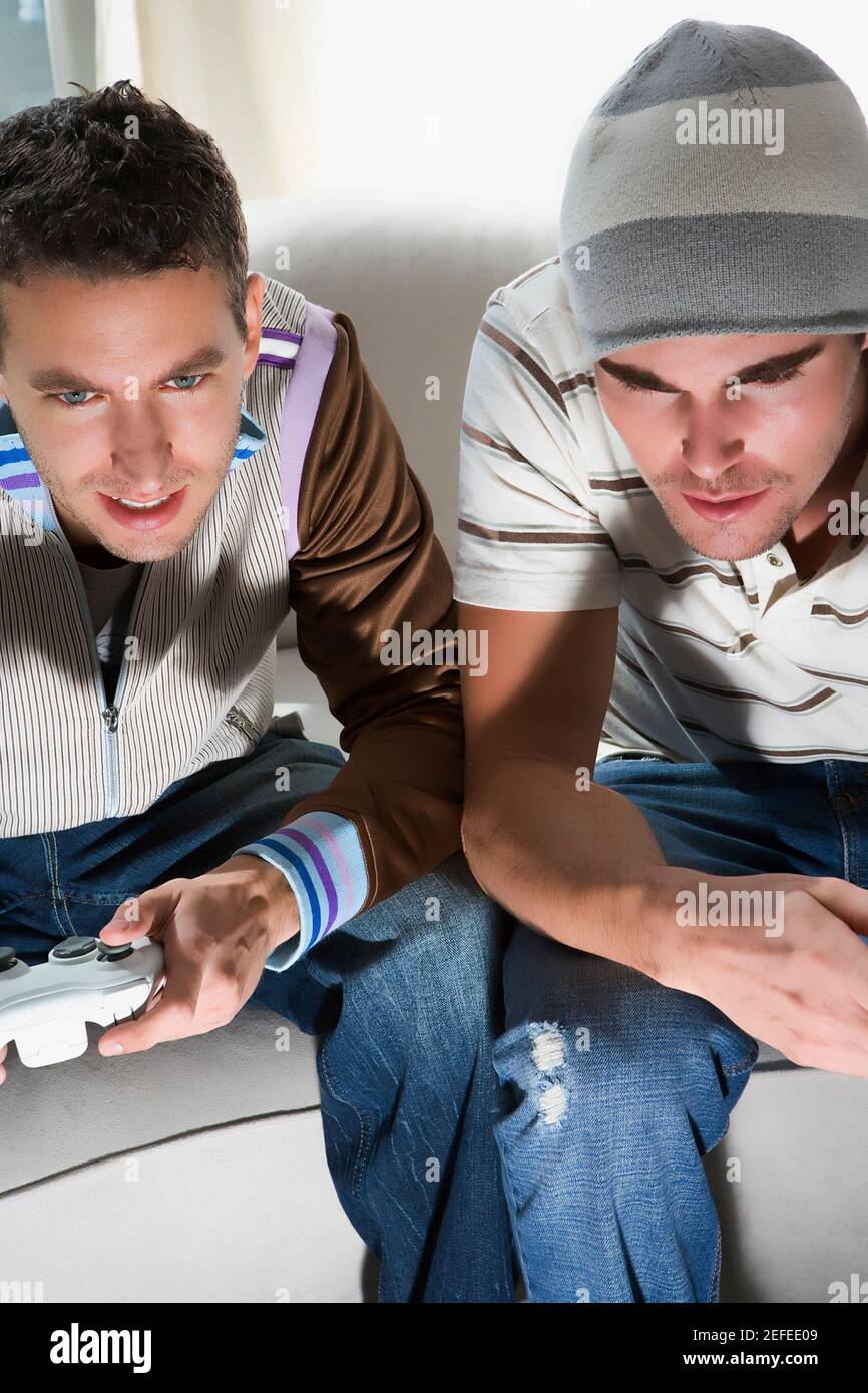 High angle view of two young men playing video game Stock Photo