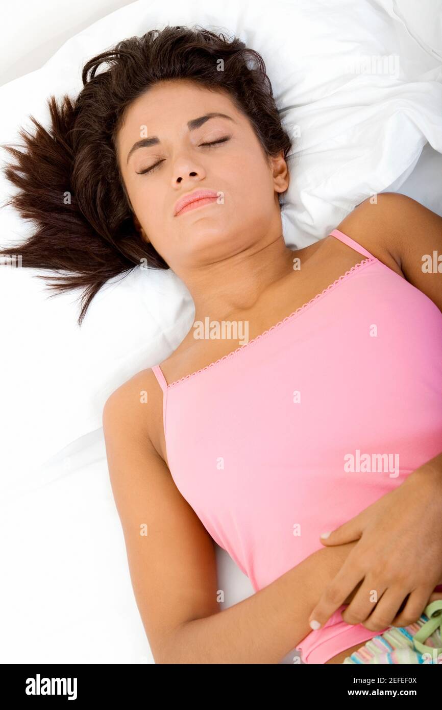 High angle view of a young woman sleeping on a bed Stock Photo