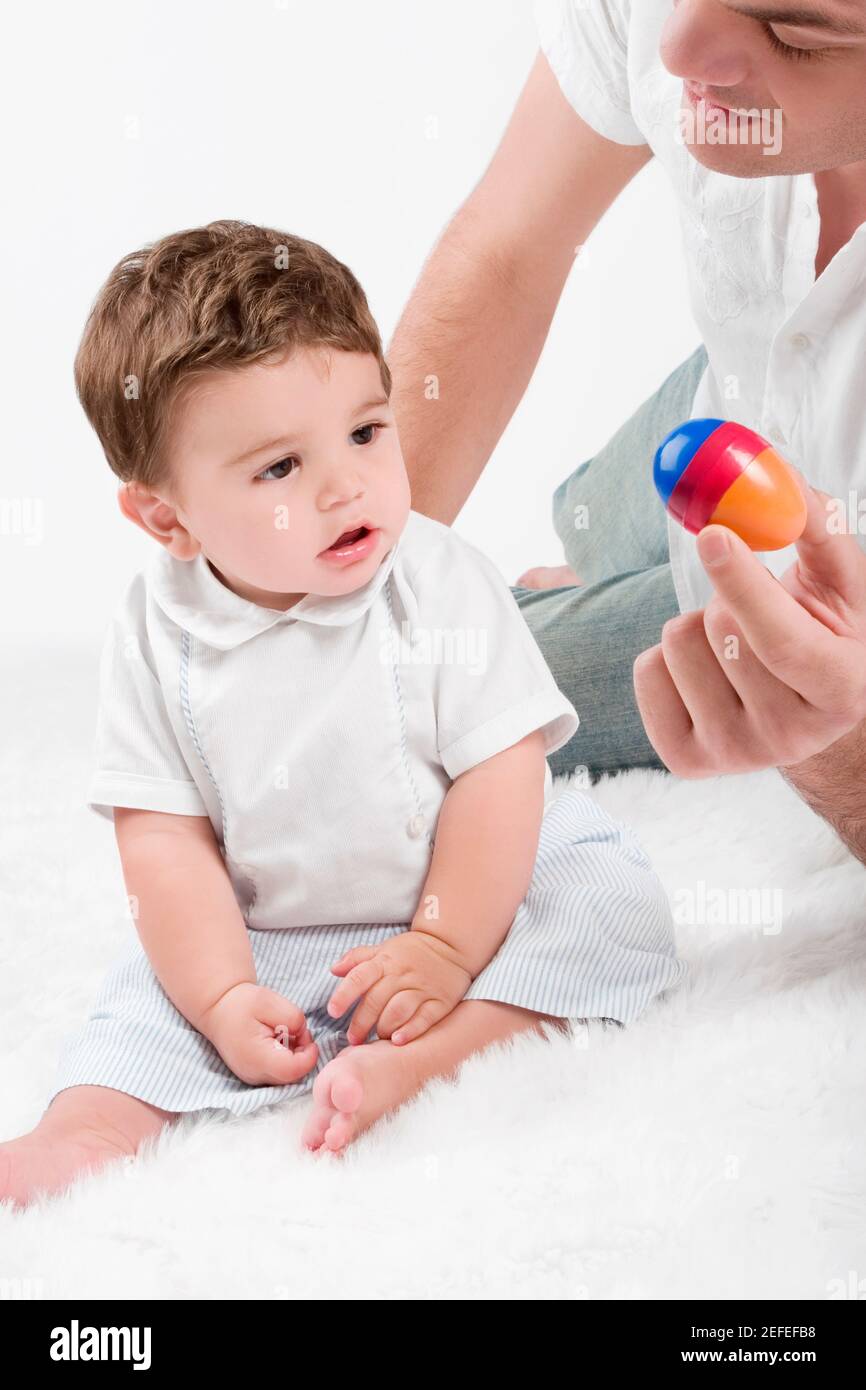 Close up of a young man playing with his son Stock Photo