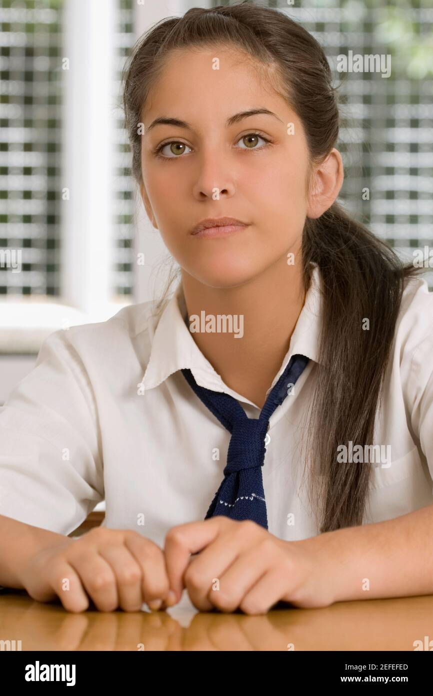 Portrait of a high school student sitting in a classroom Stock Photo
