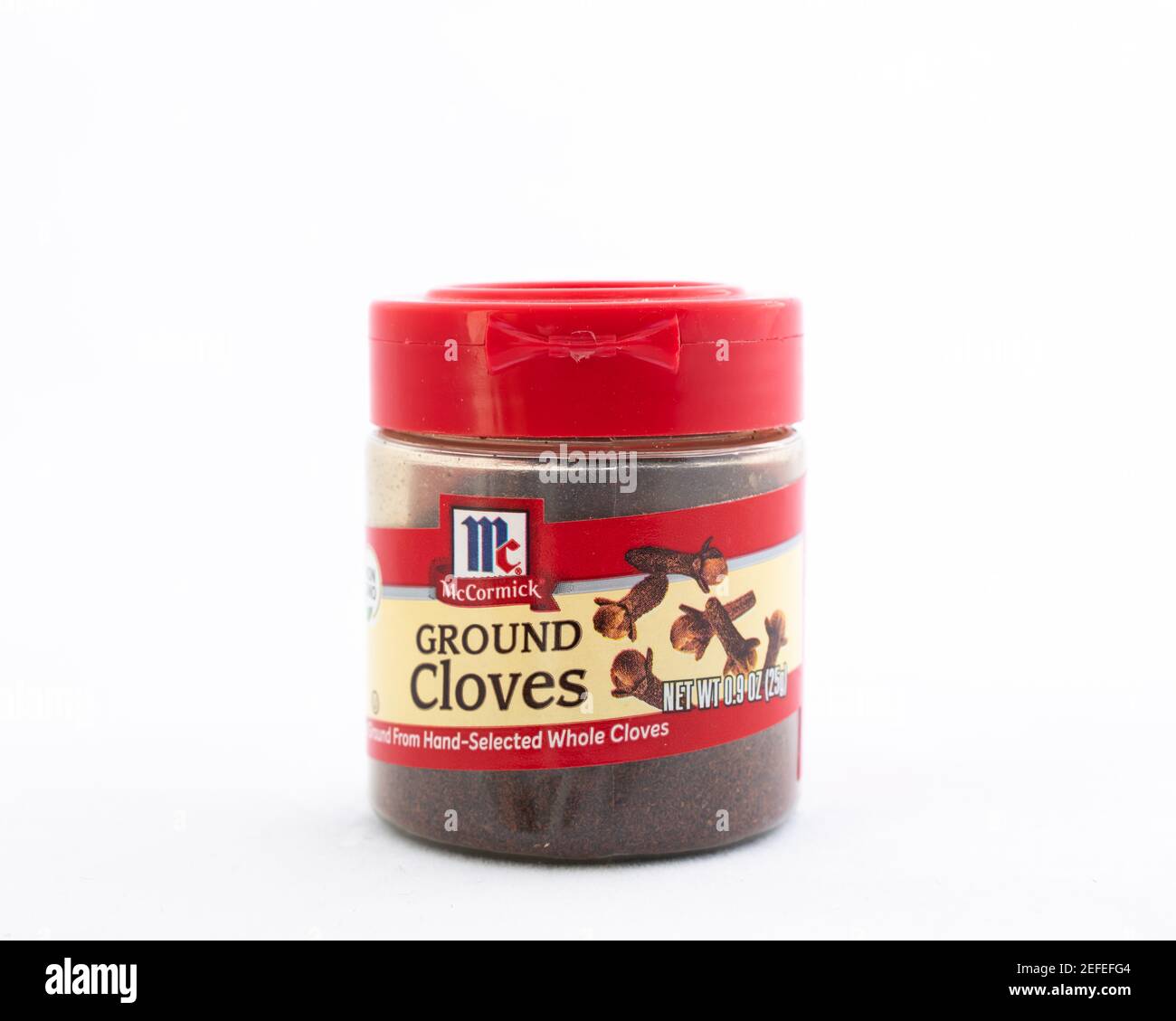 A plastic bottle of McCormick ground cloves, for bringing an intense warm flavor to foods, from the flower buds of the clove tree Stock Photo