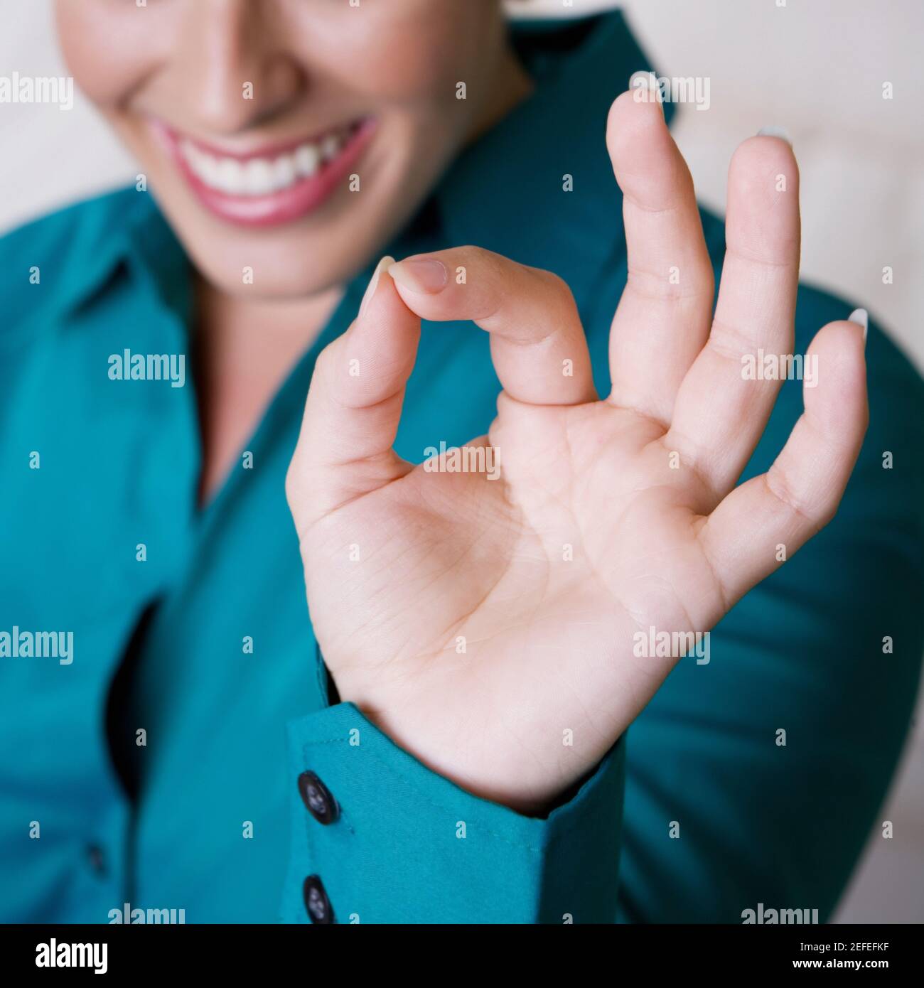 Close-up of a businesswoman making an ok sign Stock Photo