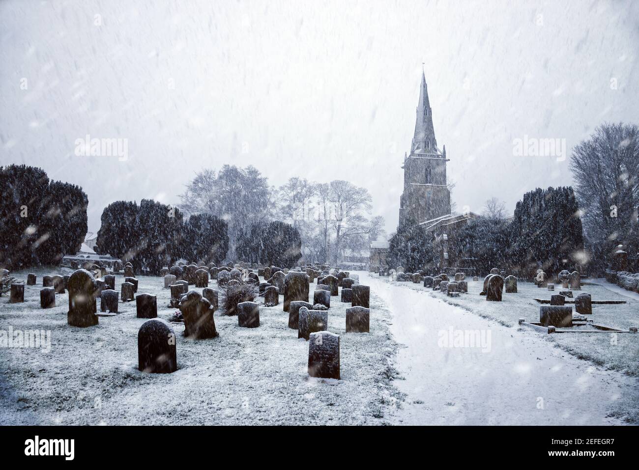 Snow scene at St Peter's Church, Sharnbrook, Bedfordshire, England, UK. Stock Photo