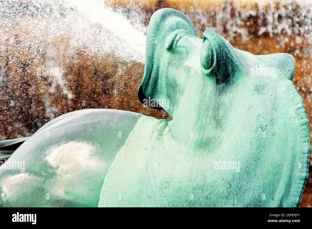 Water spraying from the mouth of a bronze statue, Clarence Buckingham Fountain, Chicago