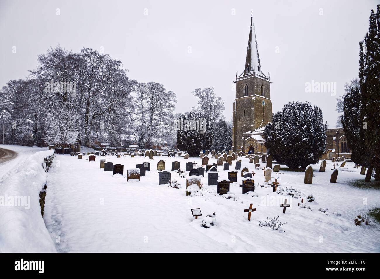 Snow scene at St Peter's Church, Sharnbrook, Bedfordshire, England, UK. Stock Photo