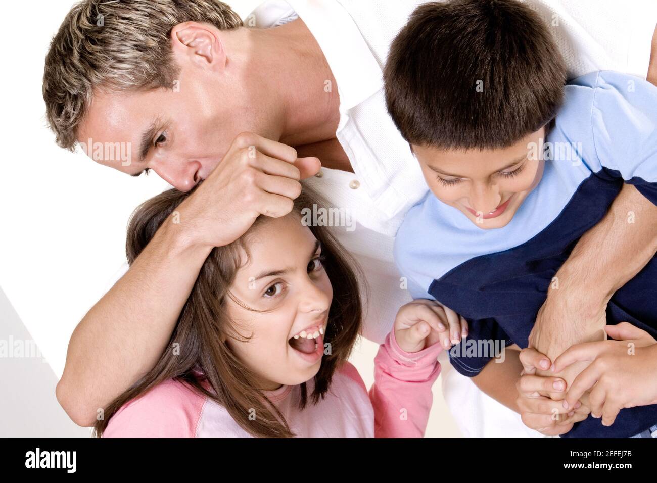 Close-up of a father with his son and daughter Stock Photo