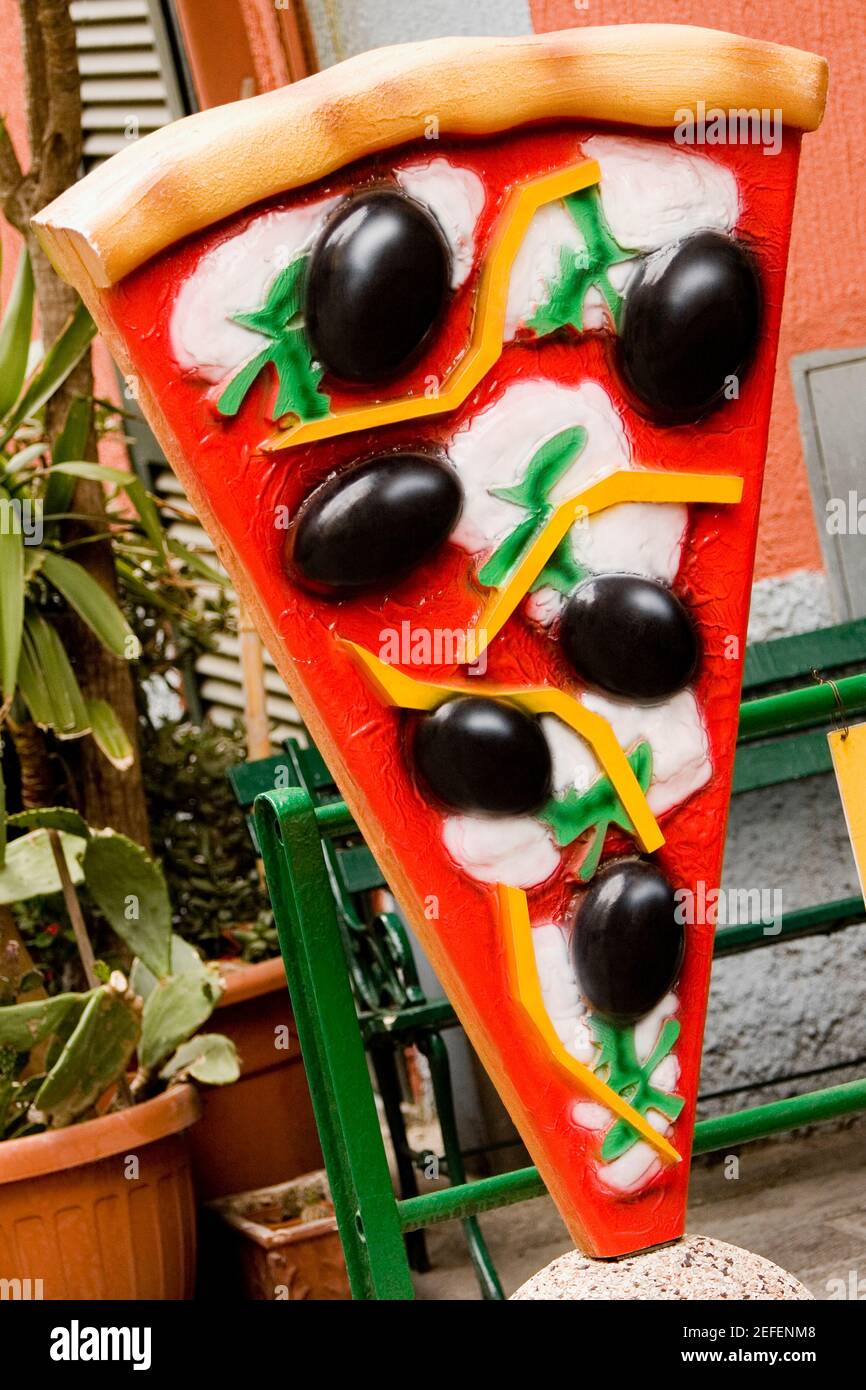 Pizza sculpture in front of a restaurant, Parco Nazionale delle Cinque Terre, Manarola, La Spezia, Italy Stock Photo