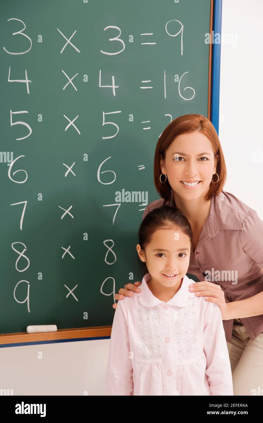 Portrait of a female teacher smiling with her student Stock Photo - Alamy