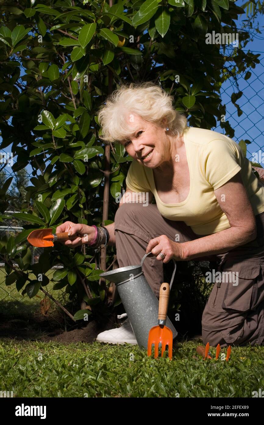 Portrait of a senior woman gardening Stock Photo - Alamy