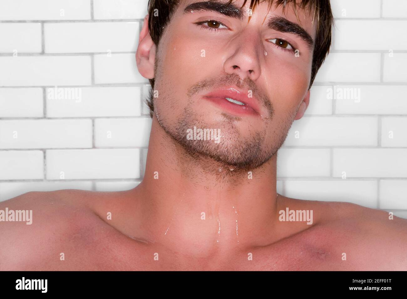 Portrait of a young man taking bath Stock Photo Alamy