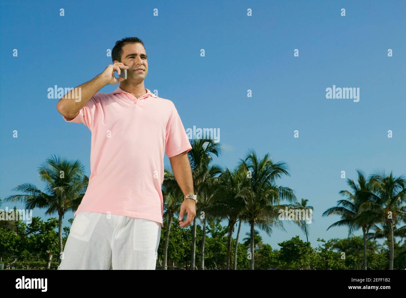 Close-up of a young man talking on a mobile phone Stock Photo