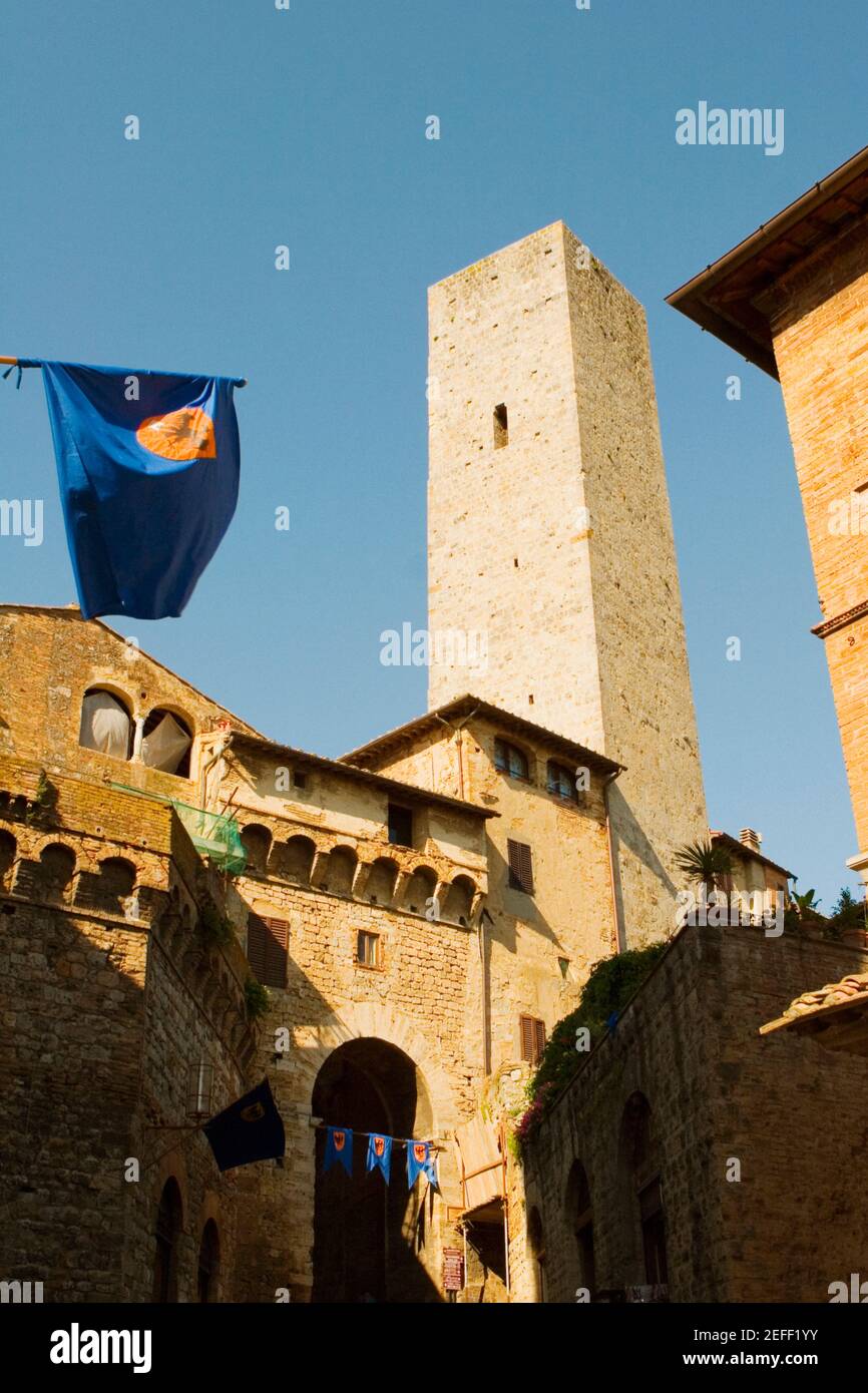 Low angle view of a tower, Torri Di San Gimignano, San Gimignano, Siena Province, Tuscany, Italy Stock Photo